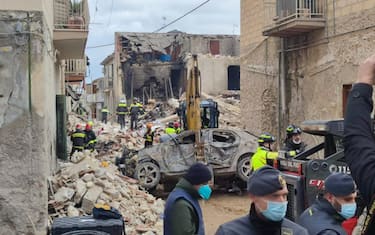 Rescues team and carabinieri helps injuried after blast caused by a gas leak in Ravanusa, Sicily, Italy, later in the night 11 December 2021 (issued 12 December 2021). Firefighters found a fourth body in the rubble of the collapsed buildings in Ravanusa. It could be a woman. Previously, the bodies of two women and a man were recovered; two survivors rescued, five people are still missing. 
ANSA/Lara Sirignano