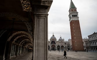People walk in Piazza San Marco on January 9, 2022 in Venice. (Photo by MARCO BERTORELLO / AFP) (Photo by MARCO BERTORELLO/AFP via Getty Images)