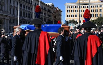 Pallbearers carry the casket of late European Parliament speaker David Sassoli, draped in the flag of the European Union, for his funeral ceremony  on January 14, 2022 at the Basilica Santa Maria degli Angeli e dei Martiri in Rome. - Sassoli died on January 11, 2022 in the hospital where he had been admitted on December 26 for "a serious complication due to a dysfunction of the immune system". (Photo by Vincenzo PINTO / AFP) (Photo by VINCENZO PINTO/AFP via Getty Images)