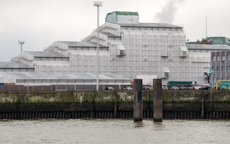 The Dilbar superyacht, owned by Russian billionaire Alisher Usmanov, under cover while undergoing refitting at the Blohm & Voss dock in Hamburg, Germany, on Friday, March 4, 2022. The superyacht, estimated to be worth $594 million by the Bloomberg Billionaires Index, hasn't been seized by the government after Usmanov was hit with European Union sanctions this week. Photographer: Imke Lass/Bloomberg