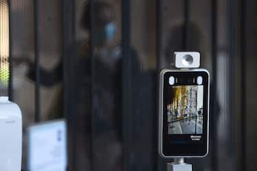 A view shows an iAccess ScanFACE control biometric terminal, with facial recognition and body temperature control, as visitors arrive at the Colosseum monument which reopens to the public on June 1, 2020 in Rome, while the country eases its lockdown aimed at curbing the spread of the COVID-19 infection, caused by the novel coronavirus. - The Colosseum monument reopens on June 1, 2020 after having been closed since March 8, 2020, with adequate sanitary protection for staff and visitors, secure routes, compulsory reservations and modified schedules to avoid crowds at peak times. (Photo by Filippo MONTEFORTE / AFP) (Photo by FILIPPO MONTEFORTE/AFP via Getty Images)