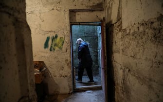 epa09811495 The director of Pustomyty kinder garden, Lessa, walks out of the bomb shelter of the kinder garden converted in a refugee shelter in Pustomyty, near Lviv, Ukraine, 08 March 2022. According to the United Nations (UN), at least 1.5 million people have fled Ukraine to neighboring countries since the beginning of Russia's invasion on 24 February.  EPA/MIGUEL A. LOPES