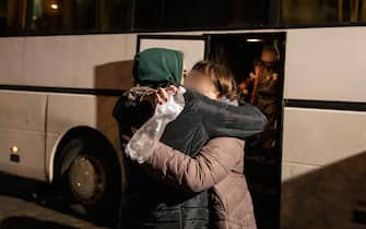 A woman hugging her friend after getting off the bus from Przemysl railway station closed to the border and arrived in Warszawa Zachodnia station.  As war crisis in Ukraine continues, millions of Ukrainians have been fled from their homeland to Poland, most of them are women and children.  Most of them temporarily resting in railway stations in Warsaw and awaiting for settling down, According to UN agency, the numbers of refugee migration have hit 1.5 million, which is the fastest-ever since the Second World War.  The Polish government has announced a plan of 8 billion zloty ($ 1.7 billion) to aid the refugees.  (Photo by Alex Chan Tsz Yuk / SOPA Images / Sipa USA)