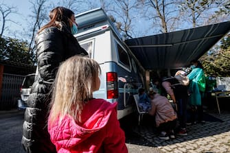 Medical staff members of the AFMA association of the Fatebenefratelli hospital visit children refugees from Ukraine at the church of Santa Sofia, in Rome, Italy, 13 March 2022. ANSA/GIUSEPPE LAMI