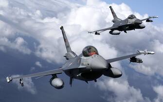 1234900093 MALBORK, POLAND - AUGUST 27: Turkish F-16 fighter jet pilots fly by C-295M Casa military cargo plane of Poland as F-16 fighter jets of Turkish Air Forces serve in NATO's "Air Policing" mission at 22nd Air Base Command in Malbork, Poland on August 27, 2021. (Photo by Cuneyt Karadag/Anadolu Agency via Getty Images)