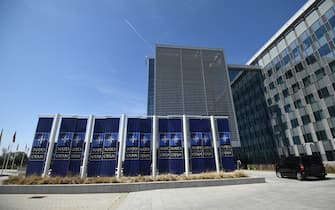 Banners with the NATO logo are pictured in front of the new NATO headquarters during a press tour of the facilities as the organization is moving from its old headquarters to the new building in Brussels on April 19, 2018. (Photo by Emmanuel DUNAND / AFP) (Photo by EMMANUEL DUNAND/AFP via Getty Images)