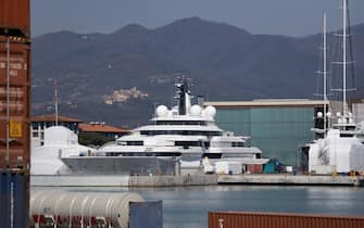 A view shows the multi-million-dollar mega yacht Scheherazade (C), docked at the Tuscan port of Marina di Carrara, Tuscany, on March 22, 2022. - The ownership of the multi-million-dollar mega yacht Scheherazade, docked on the Tuscan coast, is currently the source of speculation that it belongs to a Russian oligarch, or even perhaps President Vladimir Putin himself. Ukrainian President Volodymyr Zelensky urged Italian lawmakers on March 22 to stop their country being a playground for Russia's elite, while warning food shortages sparked by the war risk a fresh migrant crisis. (Photo by Federico SCOPPA / AFP) (Photo by FEDERICO SCOPPA/AFP via Getty Images)