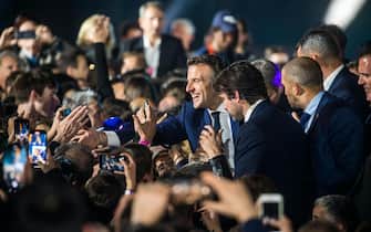 epa09907891 French President Emmanuel Macron reacts with supporters after winning the second round of the French presidential elections at the Champs-de-Mars after Emmanuel Macron won the second round of the French presidential elections in Paris, France, 24 April 2022 (issued 25 April 2022). Emmanuel Macron defeated Marine Le Pen in the final round of France's presidential election, with exit polls indicating that Macron is leading with approximately 58 percent of the vote.  EPA/Christophe Petit Tesson