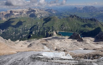 An aerial view taken from a helicopter of the missing part of a glacier that collapsed triggering an avalanche on the Marmolada Mountain in Canazei, Italy, 05 July 2022. At least seven people were killed and dozens were still missing on 04 July, a day after the avalanche hit the multi-peak mountain of the Italian Dolomites.    ANSA/ANDREA SOLERO