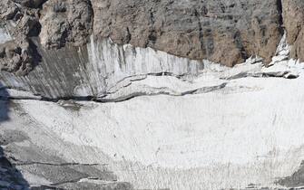 An aerial view taken from a helicopter of the glacier that collapsed triggering an avalanche on the Marmolada Mountain in Canazei, Italy, 05 July 2022. At least seven people were killed and dozens were still missing on 04 July, a day after the avalanche hit the multi-peak mountain of the Italian Dolomites.    ANSA/ANDREA SOLERO