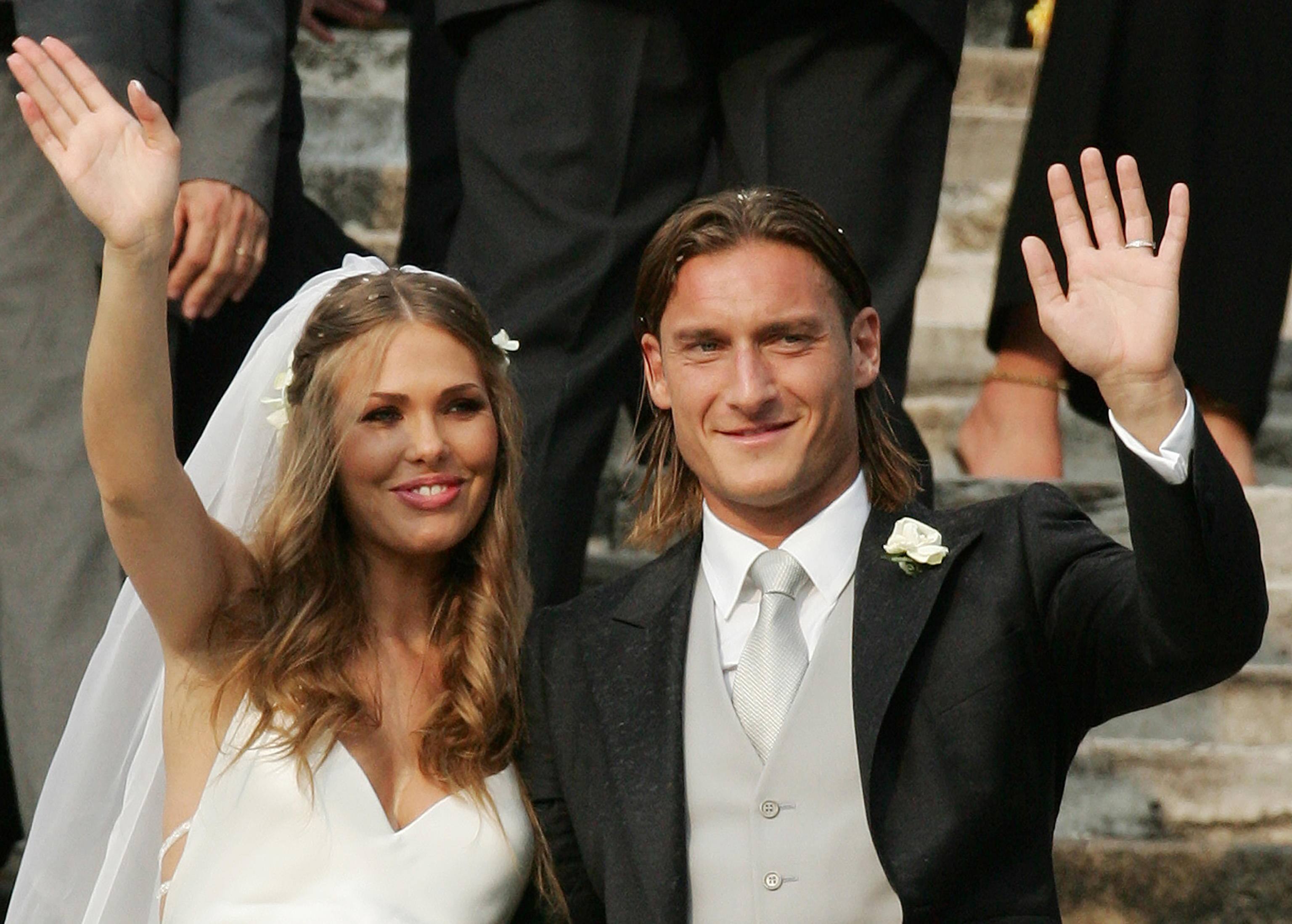 Italian international player and captain of Italian Serie A soccer team AS Roma Francesco Totti (R) and tv presenter Ilary Blasi stand on the steps of ancient Saint Mary of Ara Coeli's Basilica, on the Campidoglio hill, in downtown Rome, at the end of their wedding ceremony on Sunday, 19 June 2005.  ANSA/ETTORE FERRARI