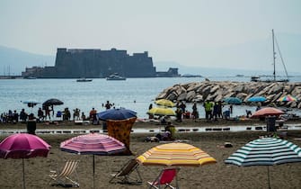 Bathers relax, sunbathe and  swim during a hot and muggy day in Naples, southern Italy, 24 July 2021. Italy's heat wave will get even hotter and stickier this weekend with temperatures rising to the mid-30s in Tuscany, Lazio, and Puglia, and as high as 42 in Sardinia. ANSA/ CESARE ABBATE