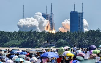 WENCHANG, CHINA - JULY 24: Spectators watch as a Long March-5B Y3 rocket carrying China's space station lab module Wentian blasts off from Wenchang Spacecraft Launch Site on July 24, 2022 in Wenchang, Hainan Province of China. (Photo by Luo Yunfei/China News Service via Getty Images)