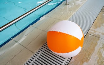PRODUCTION - 13 April 2022, Mecklenburg-Western Pomerania, Greifswald: An inflatable beach ball lies on the edge of the pool at the Greifswald leisure pool. Swimming pools, saunas and spas are energy-intensive. They depend on gas supplies, especially for the heat supply. In the short term, however, there is still no cause for concern. The leisure pool in Greifswald is also reassuring and refers to long-term contracts with the local public utility company. There are no plans to reduce the water temperature or close the sauna areas. Photo: Stefan Sauer/dpa (Photo by Stefan Sauer/picture alliance via Getty Images)