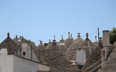 BARI, ITALY - JUNE 01: A general view of Alberobello's trullo houses, a traditional Apulian dry stone hut with a conical roof, in the Metropolitan City of Bari, Apulia region, Italy on June 01, 2022. Alberobello, a small town listed as one of the three important places in the UNESCO World Heritage List, continues to attract the attention of tourists with its unique houses. (Photo by Salih Seref/Anadolu Agency via Getty Images)
