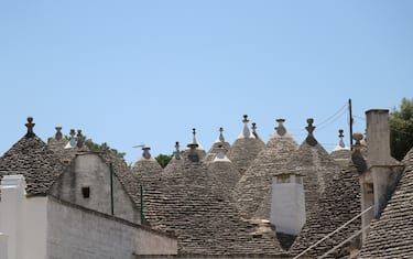 BARI, ITALY - JUNE 01: A general view of Alberobello's trullo houses, a traditional Apulian dry stone hut with a conical roof, in the Metropolitan City of Bari, Apulia region, Italy on June 01, 2022. Alberobello, a small town listed as one of the three important places in the UNESCO World Heritage List, continues to attract the attention of tourists with its unique houses. (Photo by Salih Seref/Anadolu Agency via Getty Images)