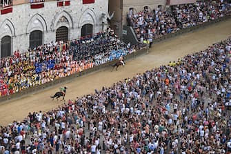 Jockey Giovanni Atzeni, called Tittia, who mounted   Violenta da codia  , wins the historical Italian horse race Palio di Siena, in Siena, Italy, 17 August 2022
ANSA/CLAUDIO GIOVANNINI