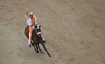 Jockey Giovanni Atzeni, called Tittia, who mounted   Violenta da codia  , wins the historical Italian horse race Palio di Siena, in Siena, Italy, 17 August 2022ANSA/CLAUDIO GIOVANNINI