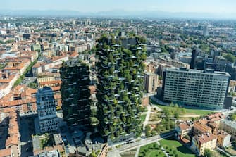 The Vertical Forest residential tower blocks, designed by Italian architect Stefano Boeri, left, in the Porta Nuova district seen from the UniCredit SpA headquarters in Milan, Italy, on Sunday July 31, 2022. UniCredit top corporate and investment bankers are betting on surging demand for risk products in the most volatile market in a decade, and taking deal-making business from rivals to help meet ambitious revenue targets set down by Chief Executive OfficerÂ Andrea Orcel. Photographer: Francesca Volpi/Bloomberg via Getty Images