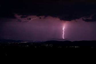 An approaching lightning storm before a summer thunderstorm in the province of Rieti. According to experts, lightning strikes in Italy are constantly increasing. The thunderstorm seen from Mount Terminillo, in the province of Rieti, (Italy), 11 August 2022. (Photo by Riccardo Fabi/NurPhoto via Getty Images)