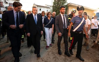 epa10188736 A handout photo made available by the Chigi Palace Press Office shows Italian Prime Minister Mario Draghi visiting the Marche region where an overnight thunderstorm caused flash floods, in Pianello Di Ostra, Italy, 16 September 2022. At least 10 people died following flooding and heavy winds.  EPA/CHIGI PALACE PRESS OFFICE HANDOUT  HANDOUT EDITORIAL USE ONLY/NO SALES