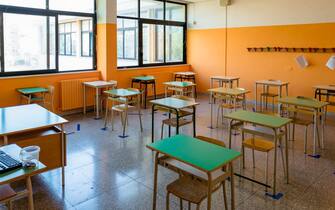 A classroom ready with the spacing and horizontal signage of the desks in the Don Tonino Bello High School in Molfetta on 16th September 2020.
The reopening of schools in Puglia is scheduled for 21 September instead of 24 September for the polling stations, after the votes for the regional elections. In the meantime, the classrooms and corridors are being prepared with the right signs for the spacing of at least 1 meter, spacing and disinfection of desks, to allow students to attend school safely avoiding infections of the COVID19 virus. (Photo by Davide Pischettola/NurPhoto via Getty Images)