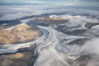 07 September 2022, Norway, Longyearbyen: Clouds surround a glacier and mountains. Photo: Sebastian Kahnert/dpa (Photo by Sebastian Kahnert/picture alliance via Getty Images)
