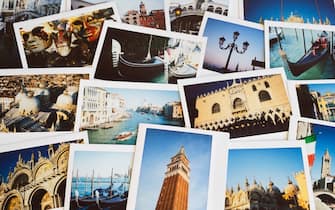 Italy, Veneto, Venice, collection of instant film holiday travel photos displayed on a table