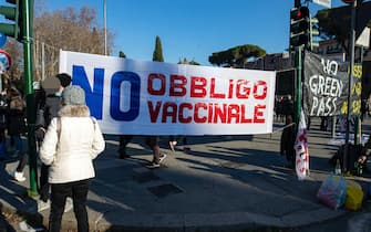 People gather during the 'No Vax and No Green Pass' protest at San Giovanni square, in Rome, Italy, 15 January 2022. In Italy it is now necessary to have the so-called Super Green Pass, which shows that a person is vaccinated for COVID-19 or has recovered from it on the last six months, to access bars, restaurants, hotels and travel on buses, subways, trains, planes and ships. Furthermore, the government has also made the Super Green Pass obligatory for all over-50s as they are considered especially vulnerable if they contract the virus. ANSA/MASSIMO PERCOSSI