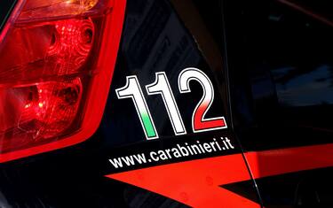 Side of an Italian Carabinieri car with emergency number 112 and website. Puglia, Italy. High quality photo
