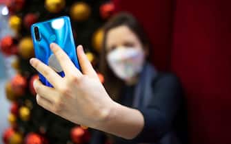 Woman taking a selfie with her smart phone