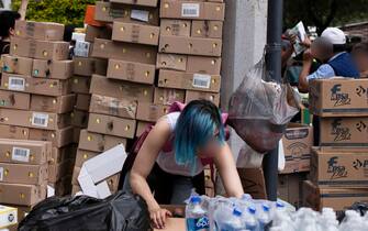 Volunteers help package supplies at the Red Cross in Mexico City