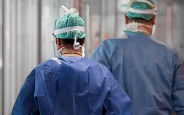 Italy, Lombardy region, Brescia, March 19, 2020 : Covid-19 virus epidemic. Coronavirus emergency, in the photo doctors and nurses at work in the inten