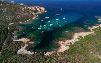 PORTO CERVO, ITALY - AUGUST 16: An aerial view of a very crowded beach in Costa Smeralda on August 16, 2022 in Porto Cervo, Italy. After two pandemic years, many Italian and foreign tourists have returned to Sardinia for their summer holidays. (Photo by Emanuele Perrone/Getty Images)