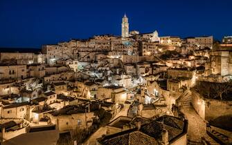 The historic center of Matera in Basilicata, at the blue hour during the Christmas period, on December 22nd 2022.
Matera is known all over the world for the Sassi. Around them opens up a rock landscape unique in the world, today falling within the Murgia Materana Park, the casket that keeps the secrets and little-known origins of the city. The city itself already embodies a magical atmosphere thanks to its architecture and its history; during Christmas then, every year, its all-white houses light up with a thousand lights and enchanting settings (Photo by Davide Pischettola/NurPhoto via Getty Images)