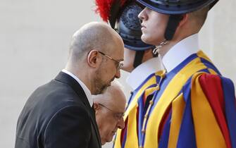 VATICAN CITY, VATICAN - APRIL 27: Ukrainian Prime Minister Denys Shmyhal (L), flanked by Monsignor Leonardo Sapienza (2nd L), arrives at St. Damaso courtyard for his audience with Pope Francis in Vatican City, Vatican, on April 27, 2023 (Photo by Riccardo De Luca/Anadolu Agency via Getty Images)
