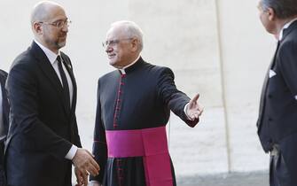 VATICAN CITY, VATICAN - APRIL 27: Ukrainian Prime Minister Denys Shmyhal (L) is welcomed by Monsignor Leonardo Sapienza (R) as he arrives at St. Damaso courtyard for his audience with Pope Francis in Vatican City, Vatican, on April 27, 2023 (Photo by Riccardo De Luca/Anadolu Agency via Getty Images)
