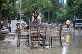 Some chairs in the middle of a flooded street following the flood that is affecting Emilia Romagna, in Faenza, Italy, 19 May 2023. A new wave of torrential rain is hitting Italy, especially the northeastern region of Emilia-Romagna and other parts of the Adriatic coast. ANSA/ FABRIZIO ZANI -PASQUAlE BOVE