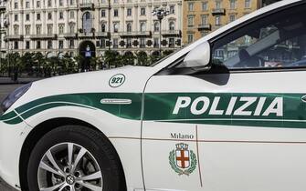 A police car of the local Polizia stands parked in the Piazza del Duomo of Milan, Italy.