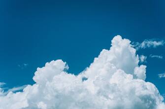 White clouds in blue sky on a sunny Summer day