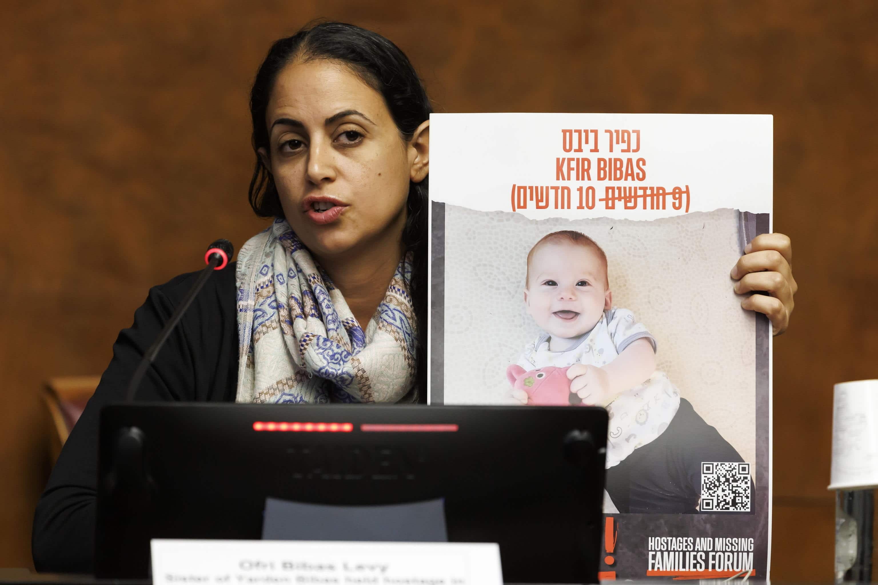 epa10974888 Ofri Bibas Levy, sister of Yarden Bibas held hostage in Gaza with his wife (Shiri) and two children (Kfir and Ariel), during a press conference about the hostages held in Gaza since the Israel Hamas war, at the European headquarters of the United Nations in Geneva, Switzerland 14 November 2023.  EPA/SALVATORE DI NOLFI