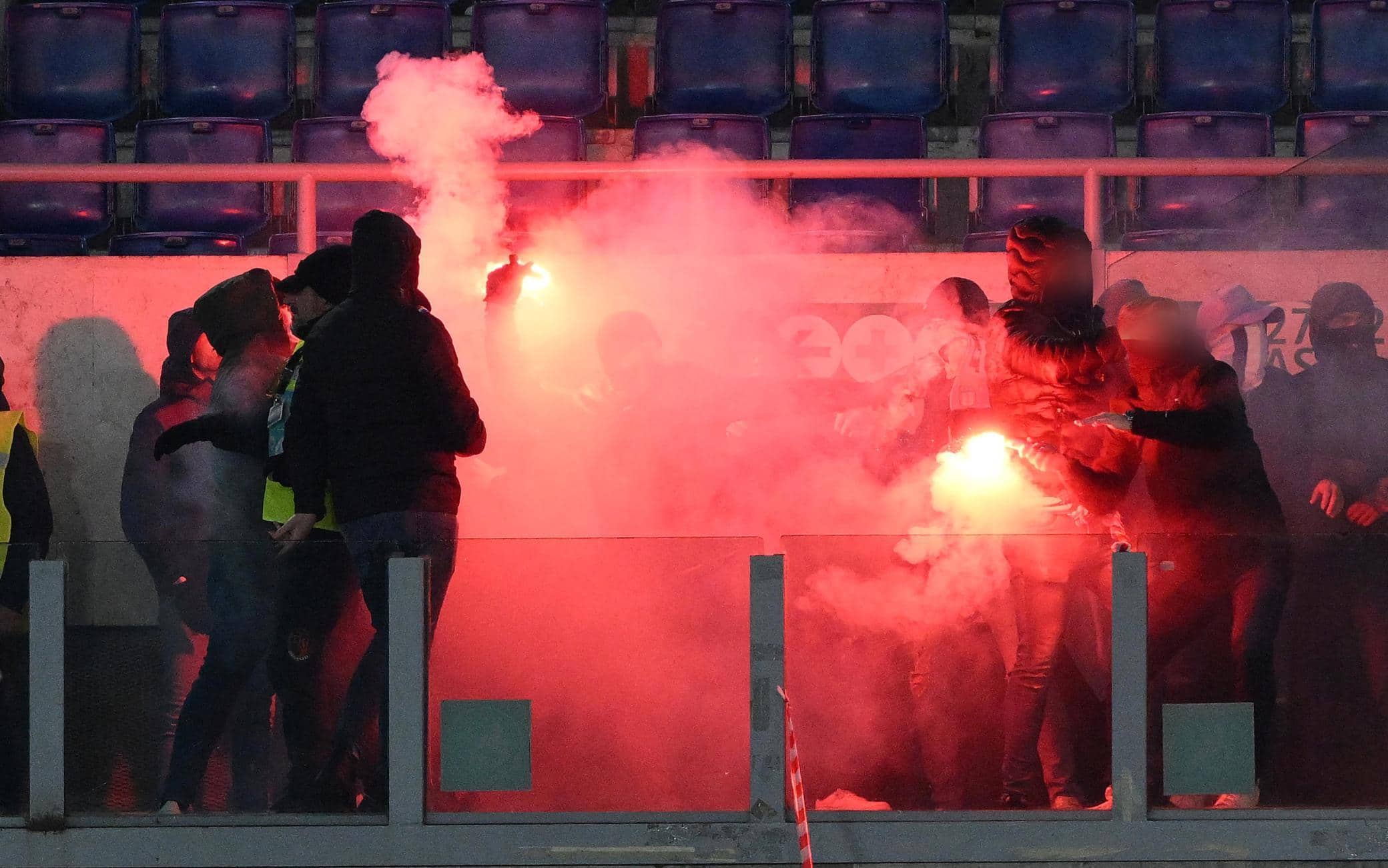 A flare is thrown into the SS Lazio' supporters block before the Italian Cup quarter final soccer match between SS Lazio and AS Roma at the Olimpico stadium in Rome, Italy, 10 January 2024.  ANSA/ETTORE FERRARI
