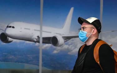 A Ukrainian tourist walks in the arrival hall of the Internatioanal Boryspil airport outside Kiev after his plane landed from China on January 30, 2020. - The first out of four special flights will be held on January 30, 2020 in order to evacuate hundreds of Ukrainian tourists from China as a deadly coronavirus outbreak grows. With no regular flights between Ukraine and China, two Ukrainian airlines, SkyUp and Ukraine International Airlines, provide charter transportation for holidaymakers to the seaside resort of Sanya on the Hainan island, but they announced a suspension of transportation after the epidemic has killed more than 130 people and spread around the world. (Photo by Sergei SUPINSKY / AFP) (Photo by SERGEI SUPINSKY/AFP via Getty Images)