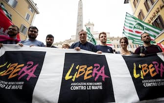 Don Luigi Ciotti (C) durante il presidio di mobilitazione contro il decreto sblocca cantieri in piazza Montecitorio, Roma, 11 giugno 2019. ANSA/MASSIMO PERCOSSI