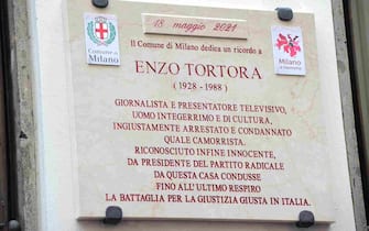 MILAN, ITALY - MAY 18: A view of a plaque in memory of Enzo Tortora during unveiling ceremony of a memorial plaque to Enzo Tortora on May 18, 2021 in Milan, Italy. Enzo Tortora was President of the Radicali party from 1985-86 and a Rai TV host. Tortora was wrongfully convicted of being a member of the Camorra in 1985 and sentenced to 10 years in jail, he was acquitted of all charges in 1987 and died in 1988. (Photo by Pier Marco Tacca/Getty Images)