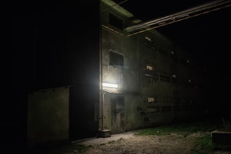 A night-view of a plant in which factory-farmed animals are typically raised specifically for meat production.
