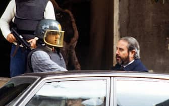 The Italian magistrate Giovanni Falcone escorted by police out of the home. Palermo, Italy, in May 7, 1985. Giovanni Falcone in 1992 was killed by the Mafia.  ( Photo by Vittoriano Rastelli )