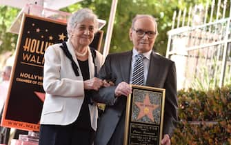 File photo dated February 26, 2016 of Maria Travia attends the ceremony her husband Ennio Morricone with a star on The Hollywood Walk of Fame in Los Angeles, CA, USA. Ennio Morricone, the Oscar winner whose haunting, inventive scores expertly accentuated the simmering, dialogue-free tension of the spaghetti Westerns directed by Sergio Leone, has died. He was 91. Photo by Lionel Hahn/ABACAPRESS.COM (Hahn Lionel/ABACA / IPA/Fotogramma, Los Angeles - 2020-07-06) p.s. la foto e' utilizzabile nel rispetto del contesto in cui e' stata scattata, e senza intento diffamatorio del decoro delle persone rappresentate