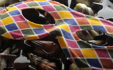 Close up of a box of chocolates with carnival mask