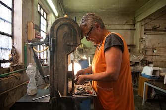 VENICE, ITALY - JULY 17: Gloria Simionato creates, using the tradional techniques of Murano, the so called Murrine on July 17, 2020 in Venice, Italy. After the lockdown for the Covid-19, the tourism in the island of Murano is at a very low level, and a lot activities are suffering and near to the closure. (Photo by Simone Padovani/Awakening/Getty Images)